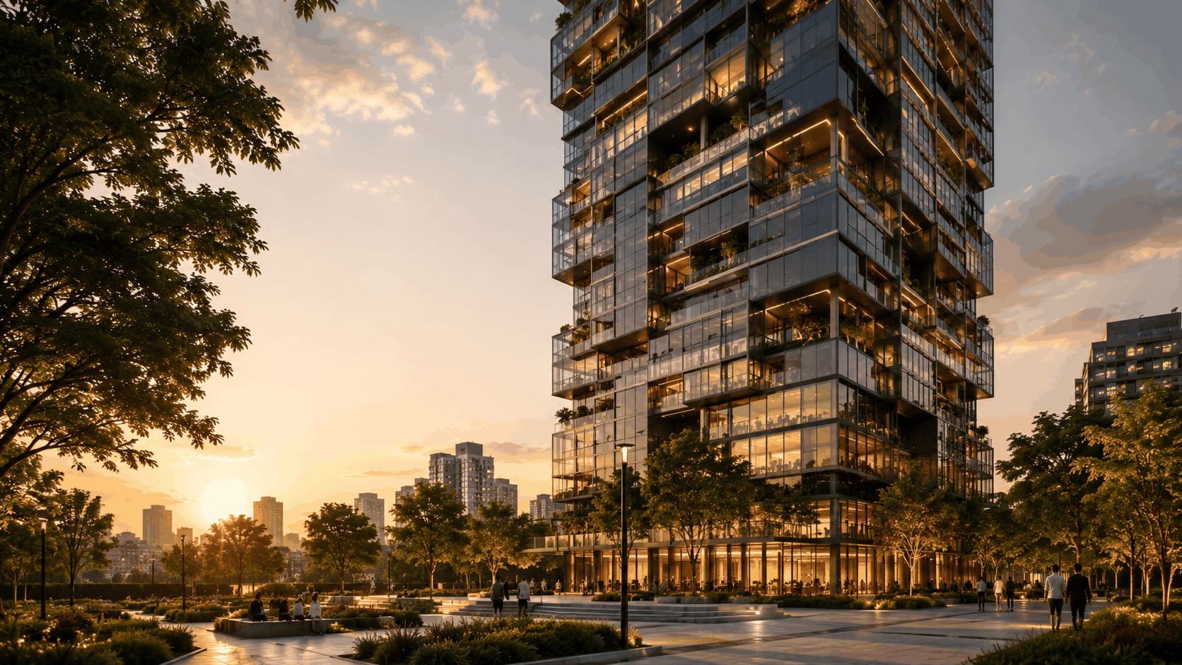 Torre residencial de cristal al atardecer con plaza ajardinada